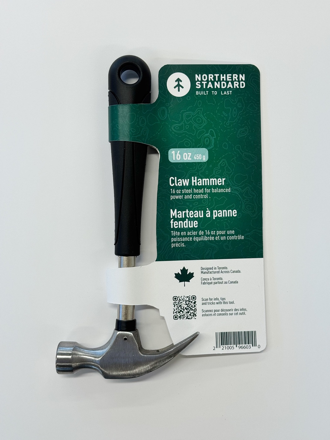 Front of the finished Northern Standard hammer prototype showing green topographic package, bilingual product name, QR code, and barcode